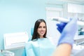 Dentist curing a female patient in the stomatology. Treatment concept. Royalty Free Stock Photo