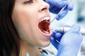 Dentist curing a female patient in the stomatology. Treatment concept. Royalty Free Stock Photo