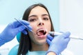 Dentist curing a female patient in the stomatology. Treatment concept. Royalty Free Stock Photo