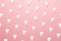 Dentist day concept. Trendy pattern made with White tooths on bright light pink background