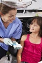 Dentist Demonstrating How To Brush Teeth