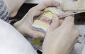 A dentist / dental technician working the partial denture Royalty Free Stock Photo