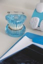 Dentist desk with x-ray and acrylic denture