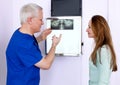 Dentist discussing an x-ray. Royalty Free Stock Photo