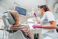 Dentist doctor examination Dental X-rays scan. Dental clinic patient visit modern medical ward. Female sitting in comfortable