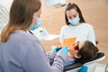 Dentist doctor filling a tooth to boy in dental office Royalty Free Stock Photo