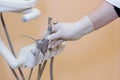 Dentist doctor hand holding medical tools in dental office. Concept of healthy Royalty Free Stock Photo