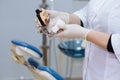 Dentist doctor hand holding sample jawbone medical tools in dental office. Concept of healthy Royalty Free Stock Photo