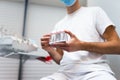 Dentist doctor holding teeth implant model in his hands.