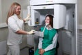 Dentist doctor prepares the patient to take x-rays of the teeth. X-ray of teeth in a dental clinic. Modern dentistry. X-ray Royalty Free Stock Photo