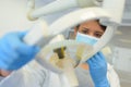 Dentist doing panoramic teeth x-ray in dental clinic