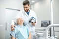 Dentist with elder woman in the dental office Royalty Free Stock Photo