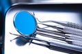 Dentist equipment on blue background Royalty Free Stock Photo