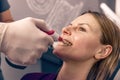 Dentist examine the colour of teeth Royalty Free Stock Photo