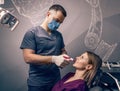 Dentist examine the colour of teeth Royalty Free Stock Photo