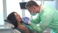 Dentist examines patient`s teeth Royalty Free Stock Photo