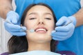 Dentist examines the patients teeth Royalty Free Stock Photo