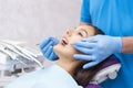 Dentist examines the patients teeth at the dentist. Royalty Free Stock Photo