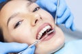 Dentist examines the patients teeth Royalty Free Stock Photo