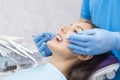 Dentist examines the patients teeth Royalty Free Stock Photo