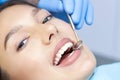 Dentist examines the patients teeth Royalty Free Stock Photo