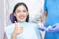 Dentist examines the patients teeth at the dentist. Royalty Free Stock Photo