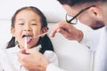 Dentist examining child teeth in dental clinic. Royalty Free Stock Photo