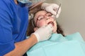 Dentist examining a girl teenager