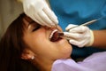 Dentist examining patient