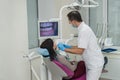 Dentist examining patient`s teeth with intraoral camera Royalty Free Stock Photo