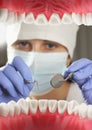 Dentist examining patient teeth, Inside mouth view. Soft focus Royalty Free Stock Photo
