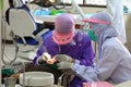 Dentist examining a patient teeth in medical treat dental Royalty Free Stock Photo