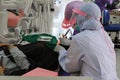 Dentist examining a patient teeth in medical treat dental Royalty Free Stock Photo