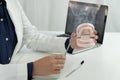 Dentist examining a patient teeth medical treatment at the dental office.