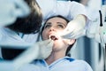 Dentist examining Patient teeth with a Mouth Mirror. Royalty Free Stock Photo