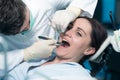 Dentist examining Patient teeth with a Mouth Mirror. Royalty Free Stock Photo