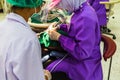 Dentist examining a patients teeth in the chair and bright light at the dental clinic