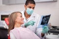 Dentist explaining the details of x-ray picture to his patient Royalty Free Stock Photo