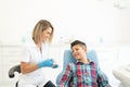 Dentist Explaining Patient At Clinic Royalty Free Stock Photo