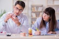 The dentist explaining student tooth structure Royalty Free Stock Photo