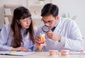 Dentist explaining student tooth structure Royalty Free Stock Photo