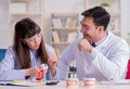 Dentist explaining student tooth structure Royalty Free Stock Photo