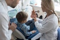 Dentist Explaining Teeth Structure to Boy Royalty Free Stock Photo