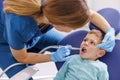 Dentist fixing child patients tooth