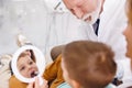 Dentist fixing tooth to a little boy