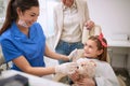 Dentist giving lollipop to child