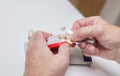 Dentist hands with color guide and plaster model Royalty Free Stock Photo