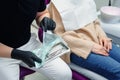 Dentist opening sealed sterile dental tools, close up. Professional dentist preparing his workplace. Royalty Free Stock Photo