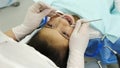 Dentist examining a teeth of little girl Royalty Free Stock Photo