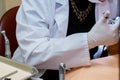 Dentist hands with tools in a patient& x27;s mouth. Close up. Royalty Free Stock Photo